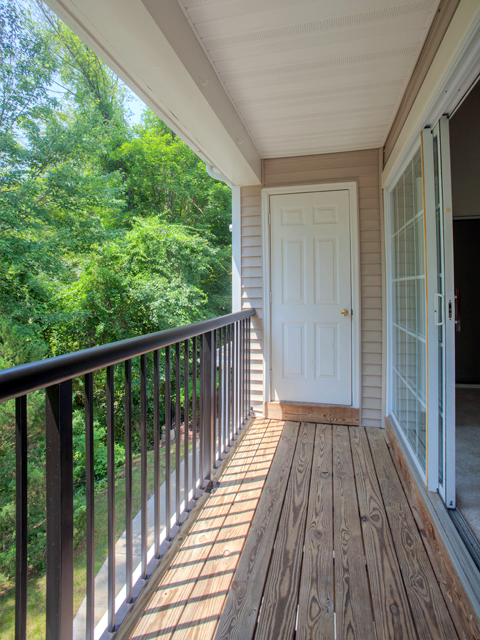 Balcony with railing and view.