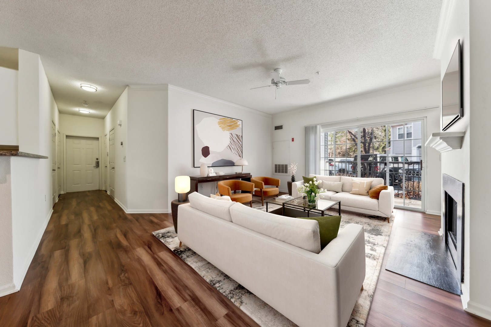 Living and dining area with table.